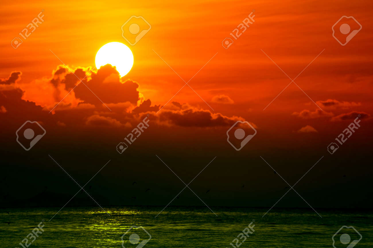 158669018-multicolor-heap-red-sunset-cloud-and-sun-on-sky-background